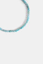 close-up of faceted amazonite beads in turquoise blue