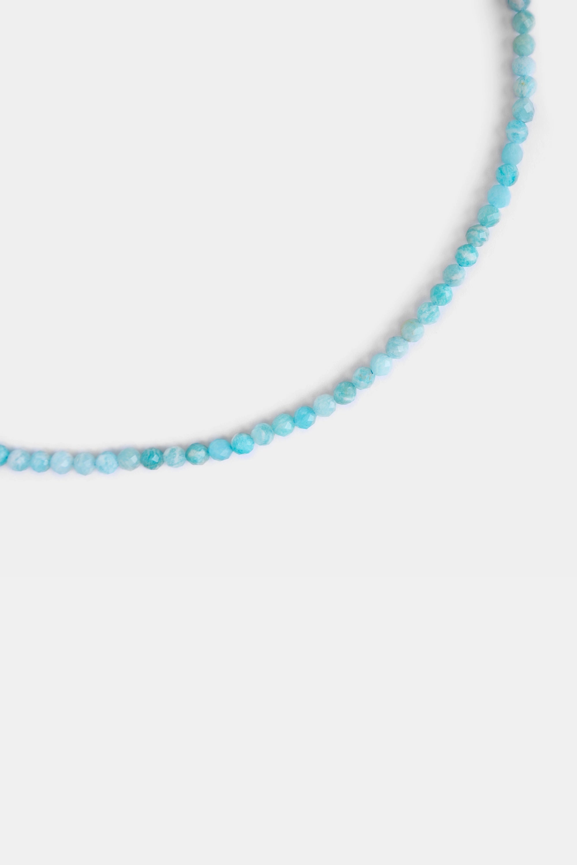 close-up of faceted amazonite beads in turquoise blue
