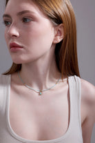 side view of aquamarine beaded necklace with teardrop pendant