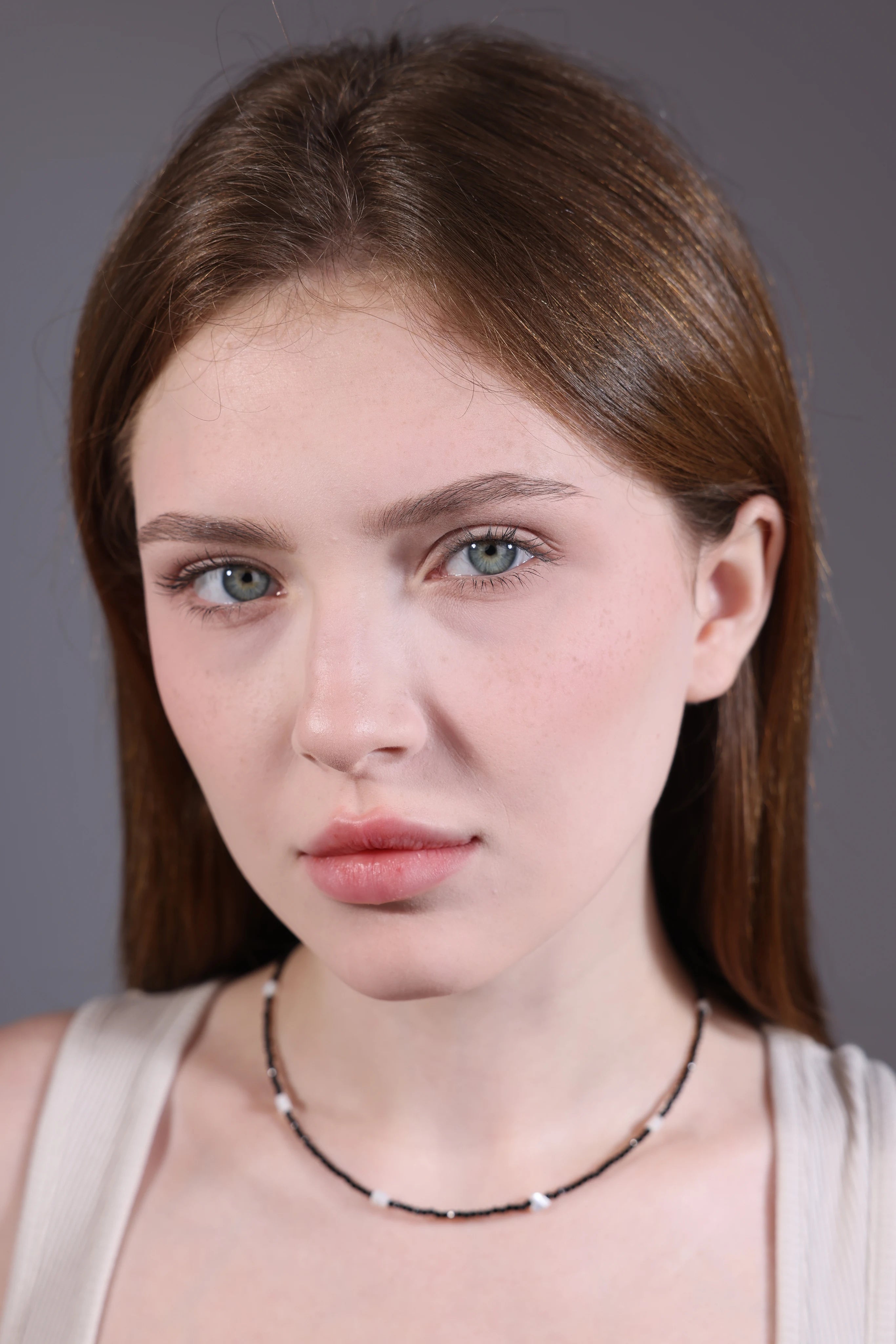 black seed bead choker with white heart beads – portrait view