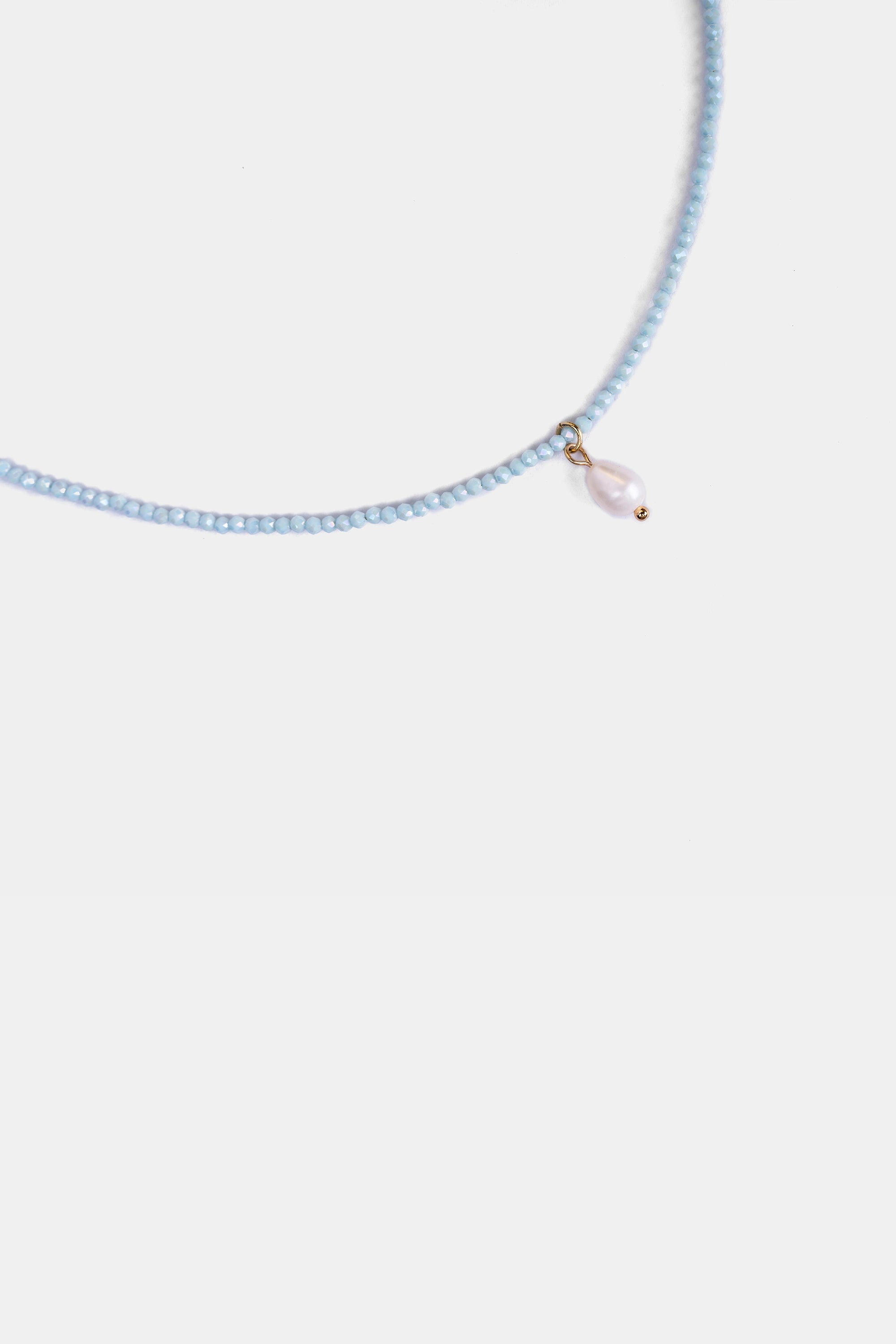 close-up of micro-faceted blue chalcedony beads with freshwater pearl charm