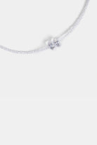 close-up of clear crystal bow bead pendant