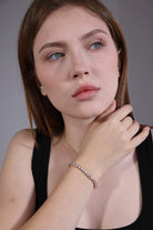 model wearing gold CZ tennis bracelet – elegant minimalist style