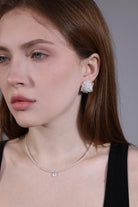 model wearing light blue beaded necklace with clear quartz charm – minimalist style