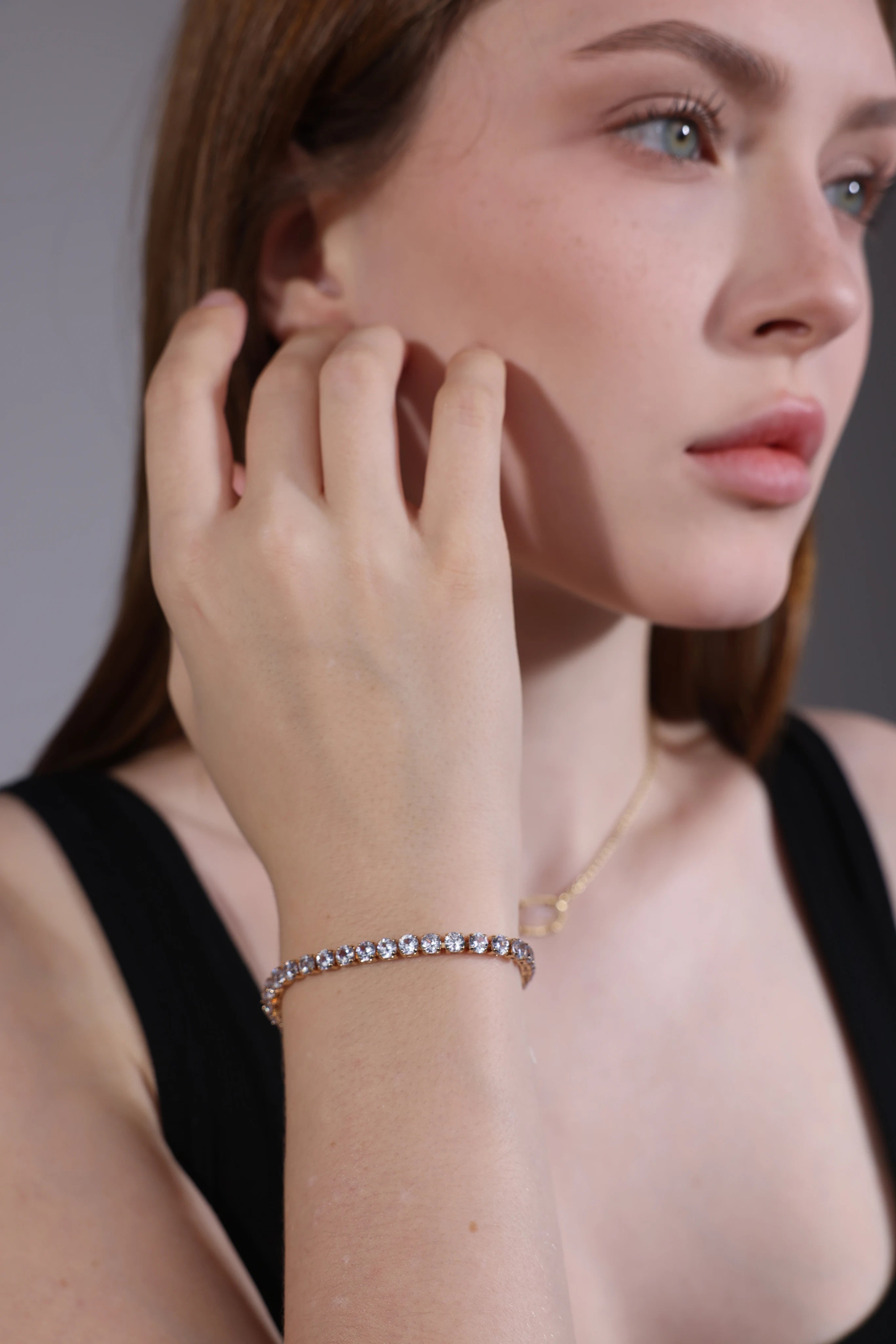 gold cubic zirconia tennis bracelet for layering – portrait view