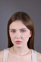 side view of pink tourmaline choker with pearl center