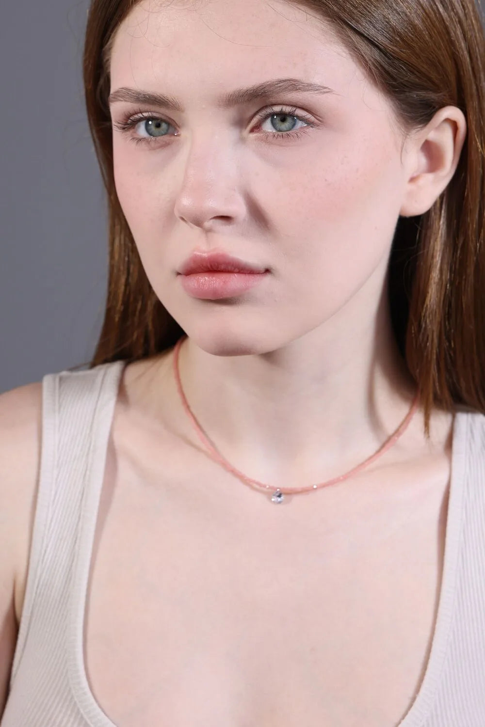 model wearing rose quartz pink crystal choker for minimalist layering