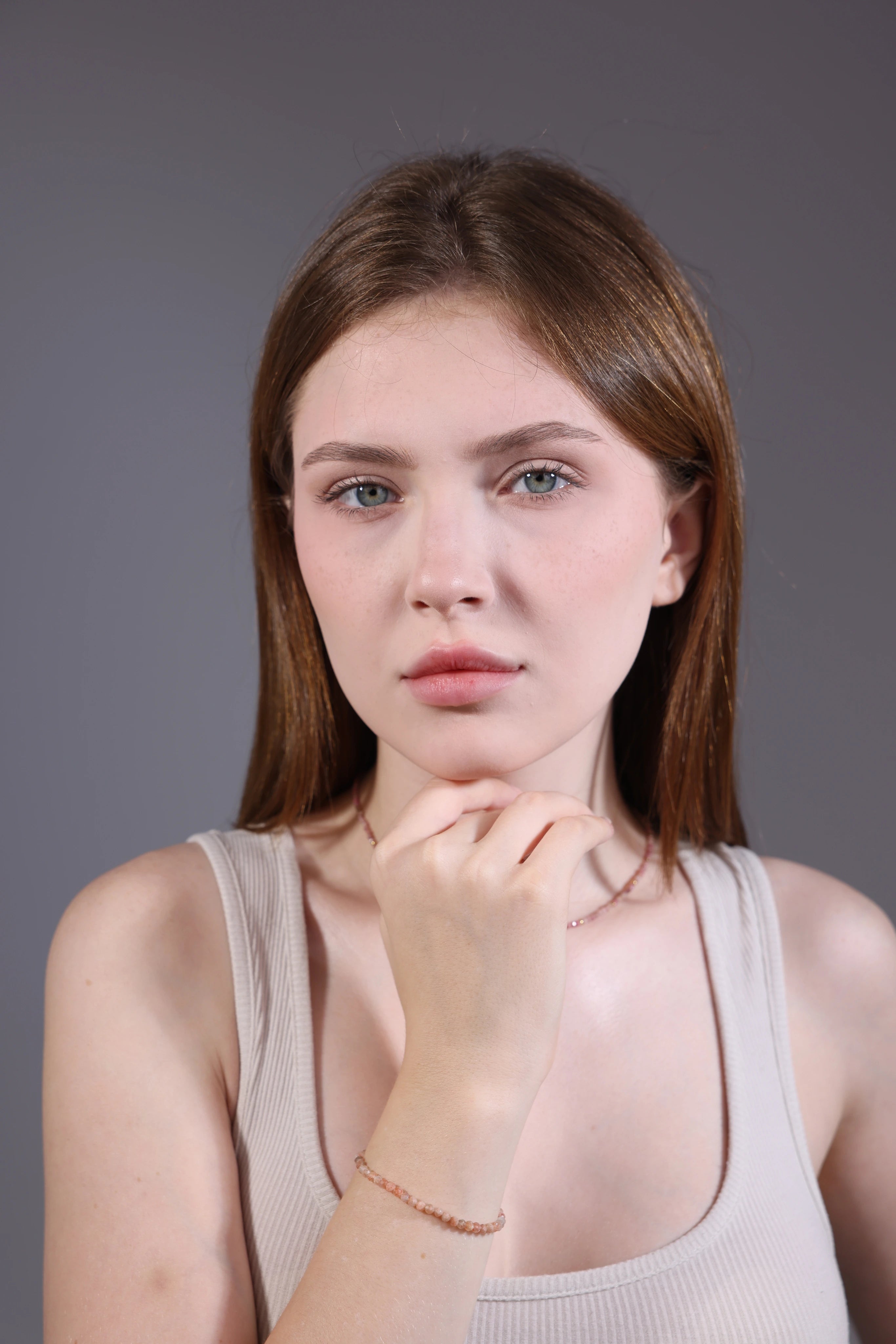 model wearing strawberry quartz bracelet – dainty minimalist jewelry