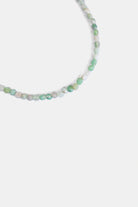 close-up of faceted moss agate beads in mint green