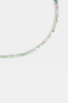close-up of faceted moss agate beads in mint green