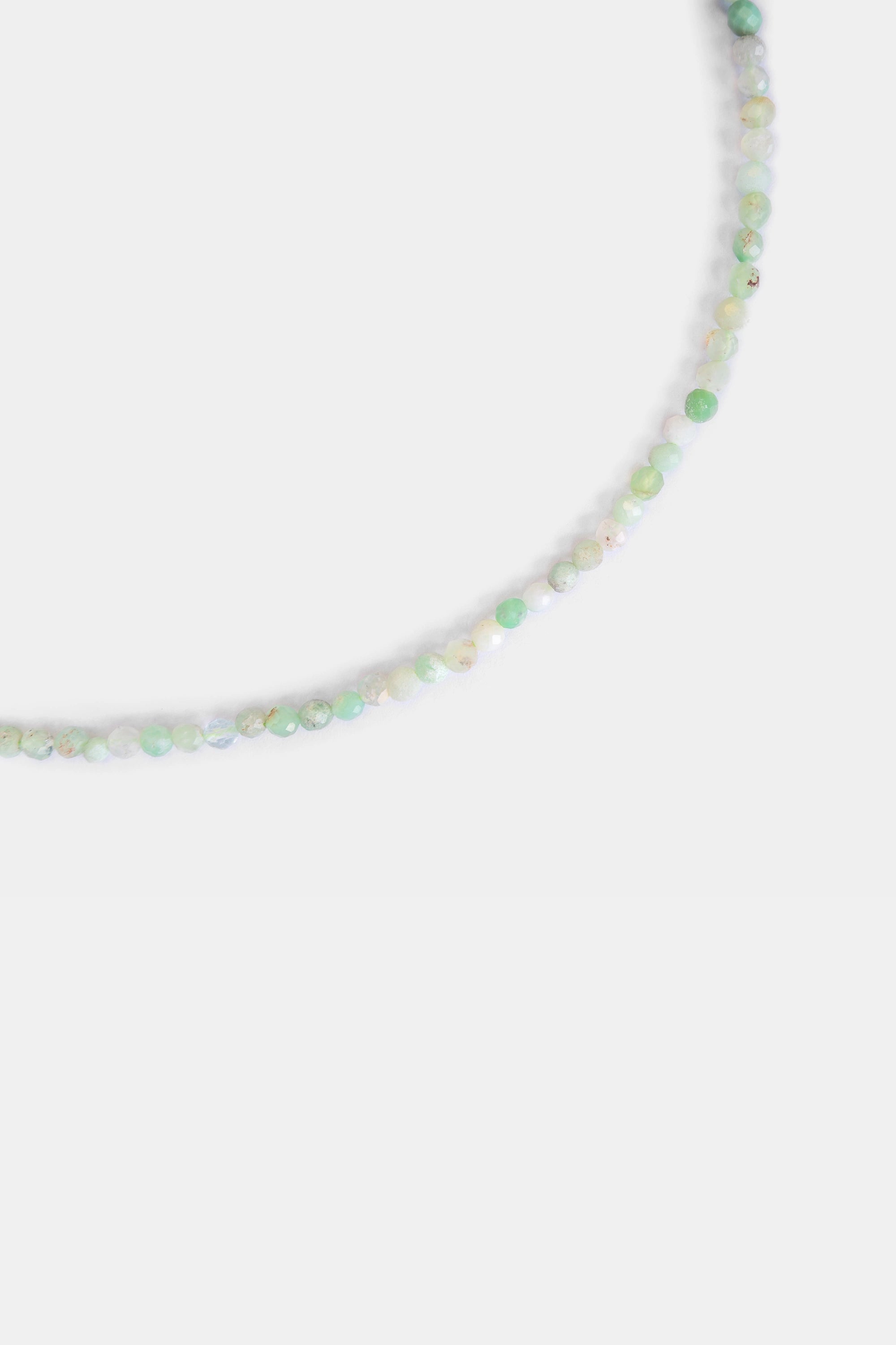 close-up of faceted moss agate beads in mint green