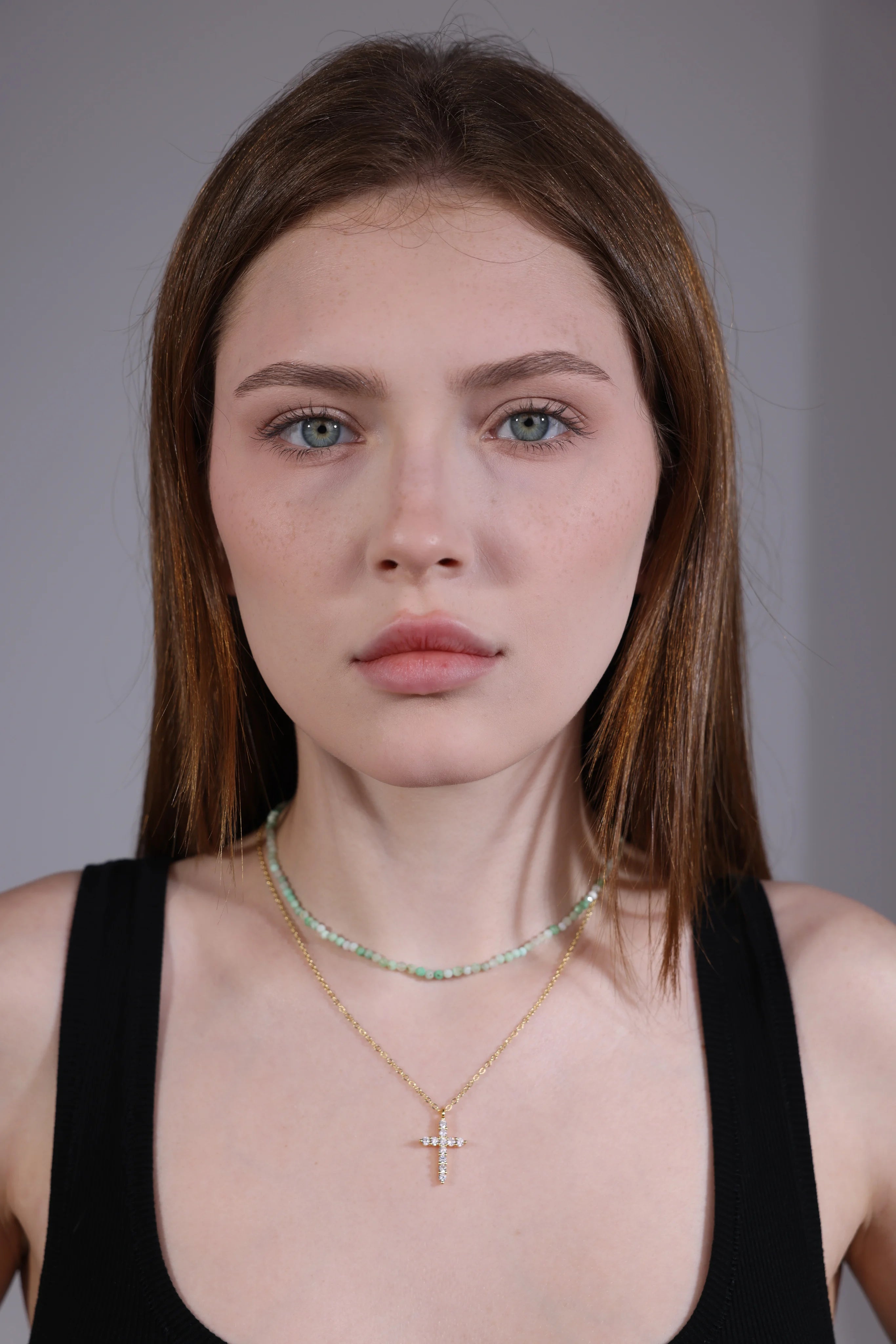 mint green gemstone beaded necklace layered with gold chain