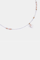 close-up of freshwater pearl pendant with seed beads and rose gemstone accents