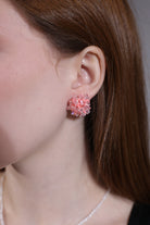 close-up portrait of pink hydrangea beaded earrings – delicate floral studs