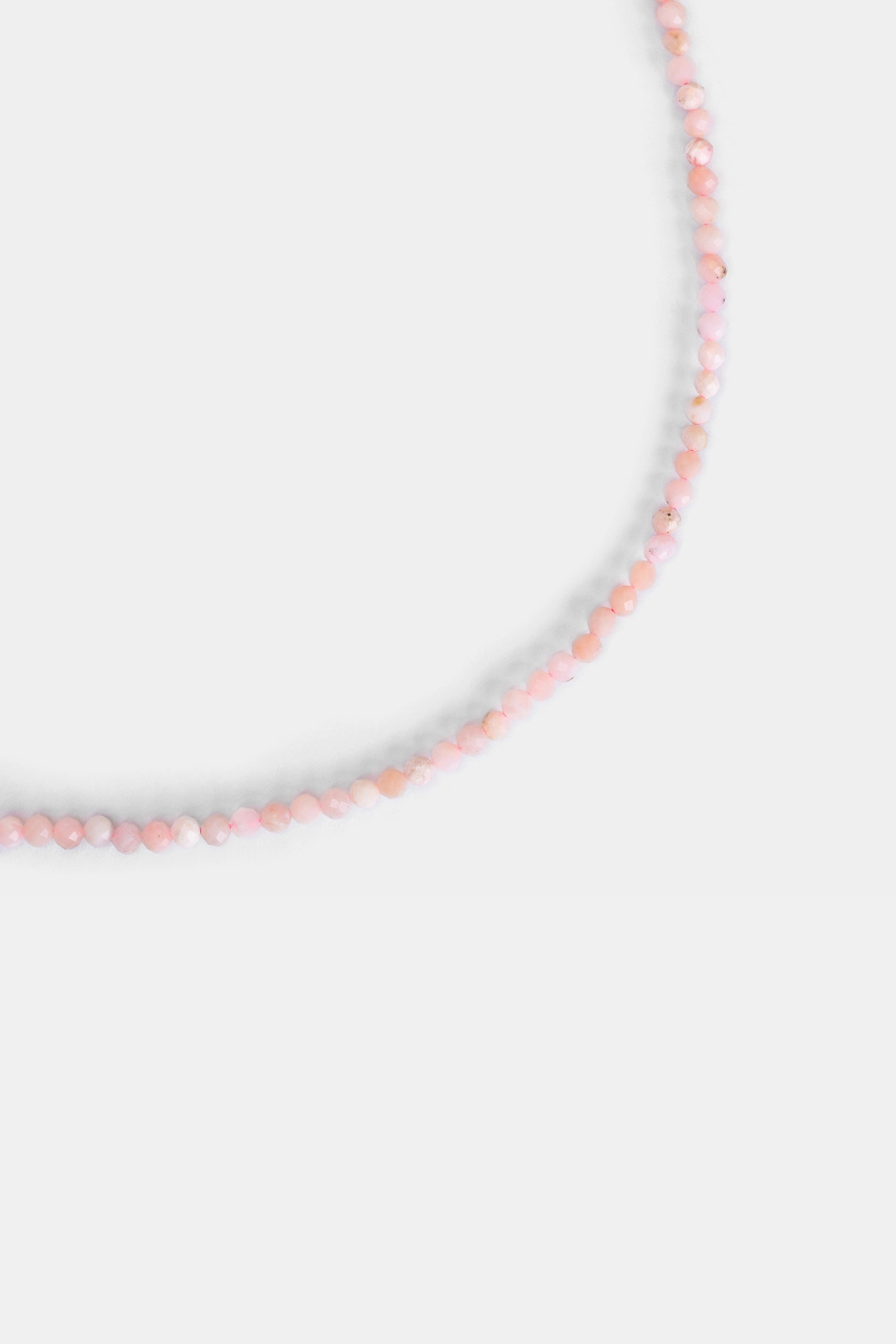 close-up of 3.2 mm faceted pink opal beads in blush tones