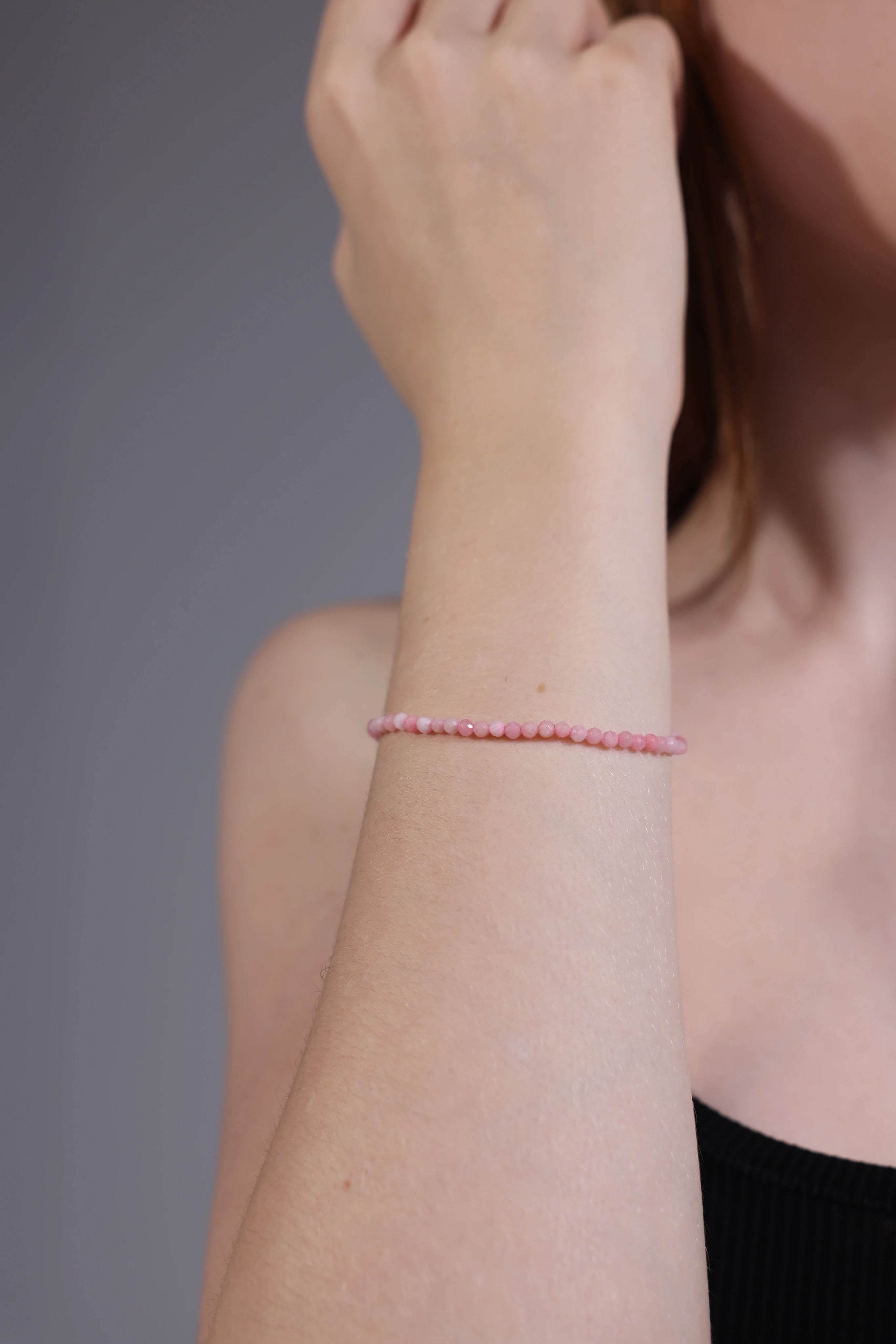 pink gemstone bracelet on wrist – stacking style