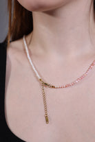 pink opal necklace layered with a white bracelet – styling idea (necklace only for sale)