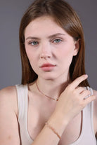 pink tourmaline pearl choker layered with matching beaded bracelet