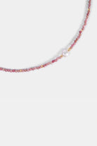 close-up of pink tourmaline seed beads with freshwater pearl center