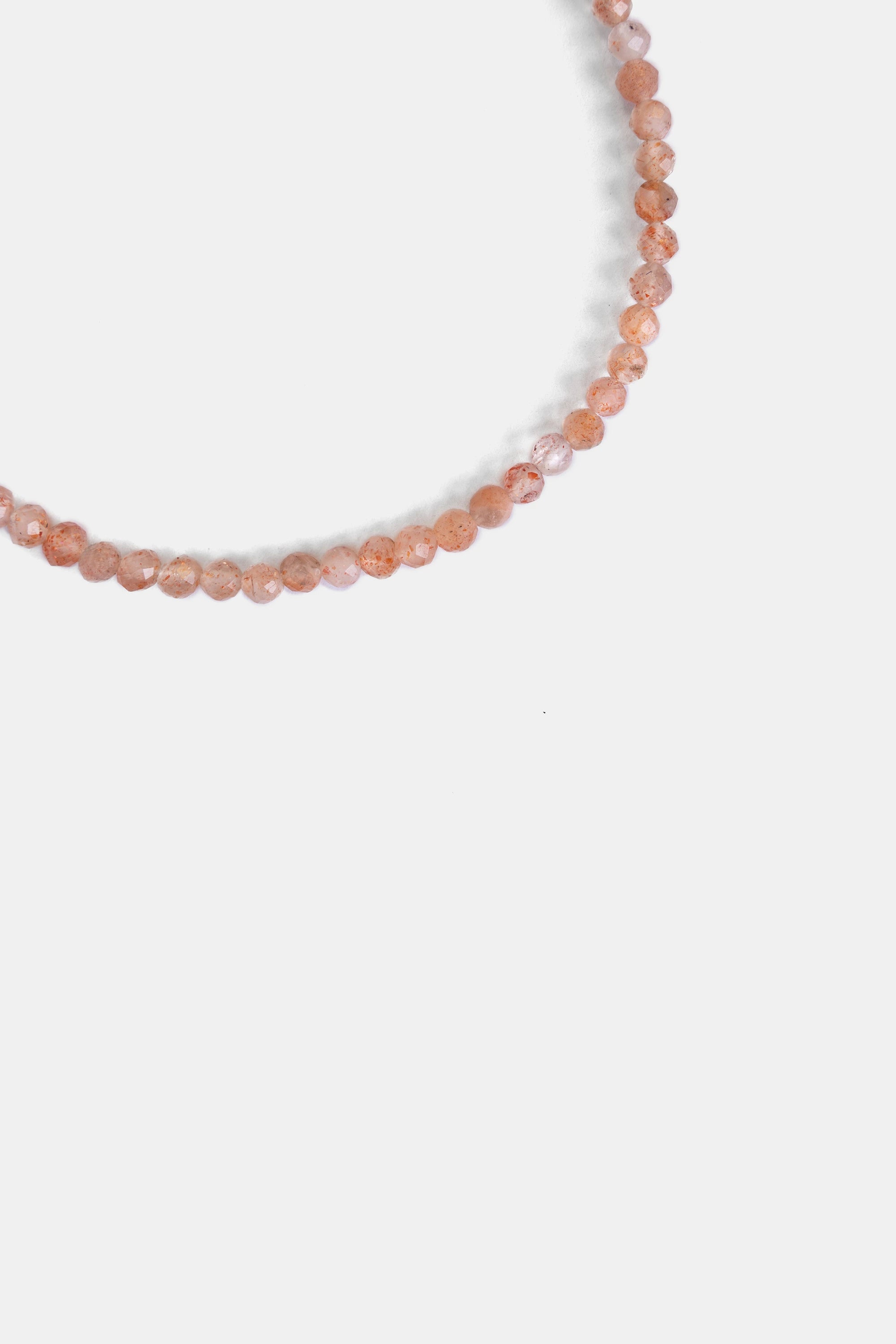 close-up of faceted strawberry quartz pink beads