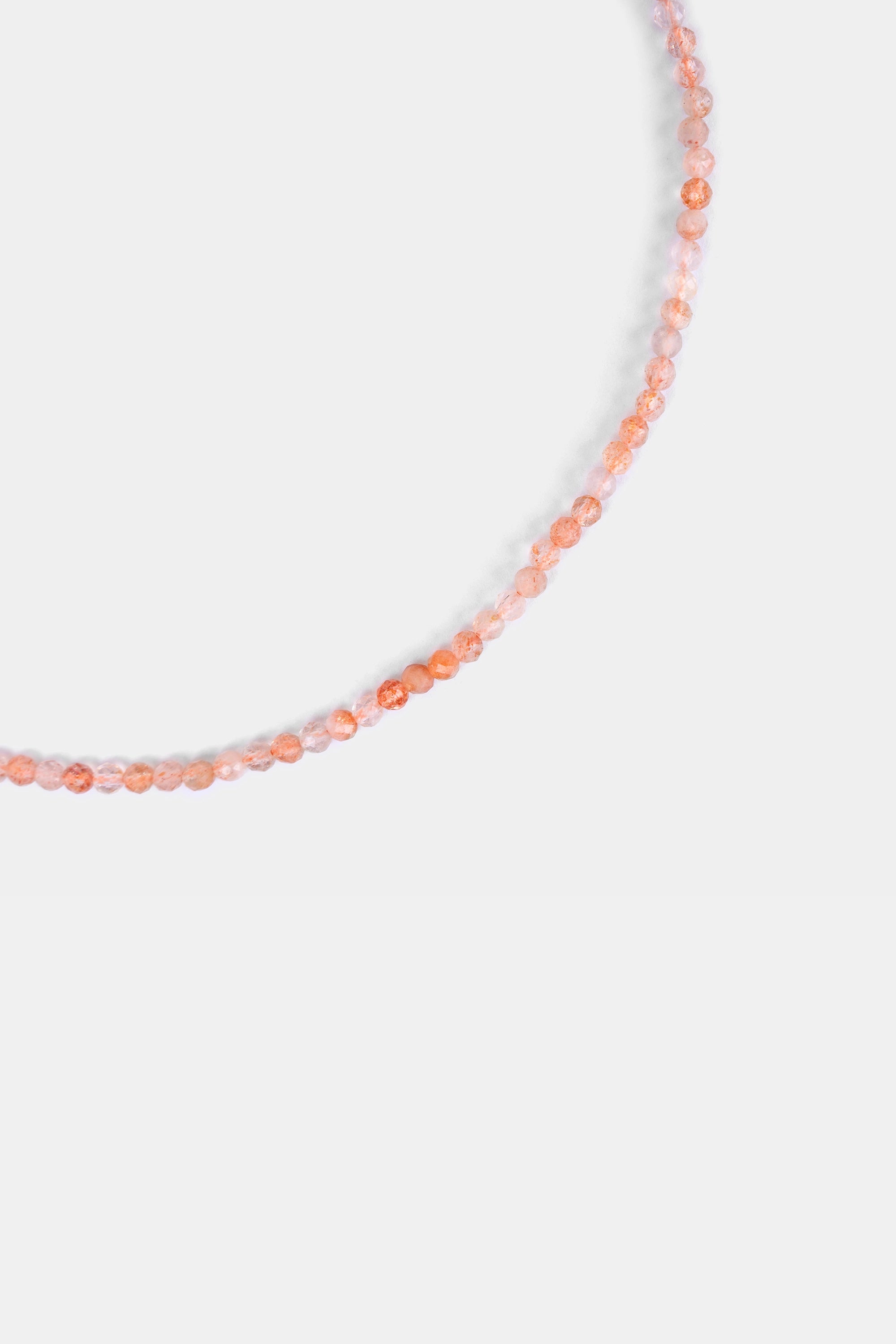 close-up of faceted strawberry quartz beads in blush pink