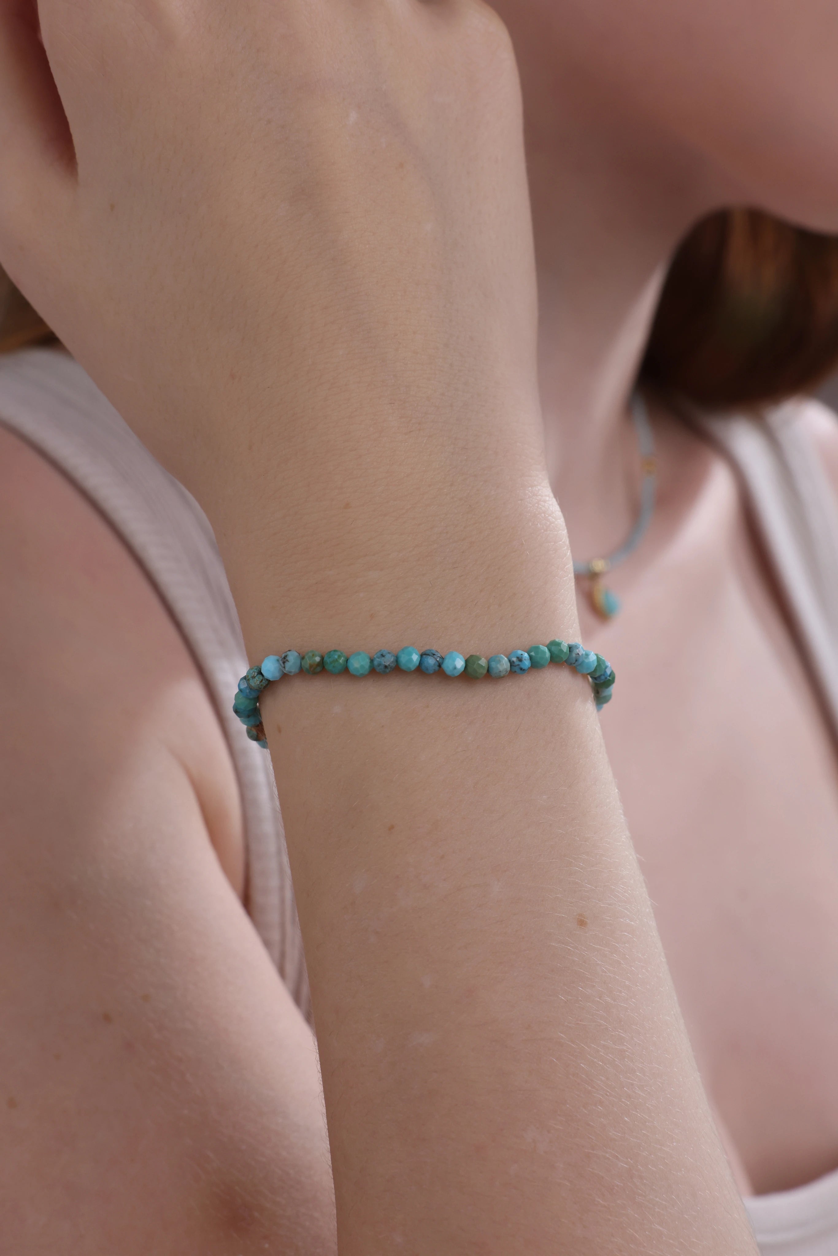 close-up of turquoise beaded bracelet on wrist – Velvet Luminance jewelry