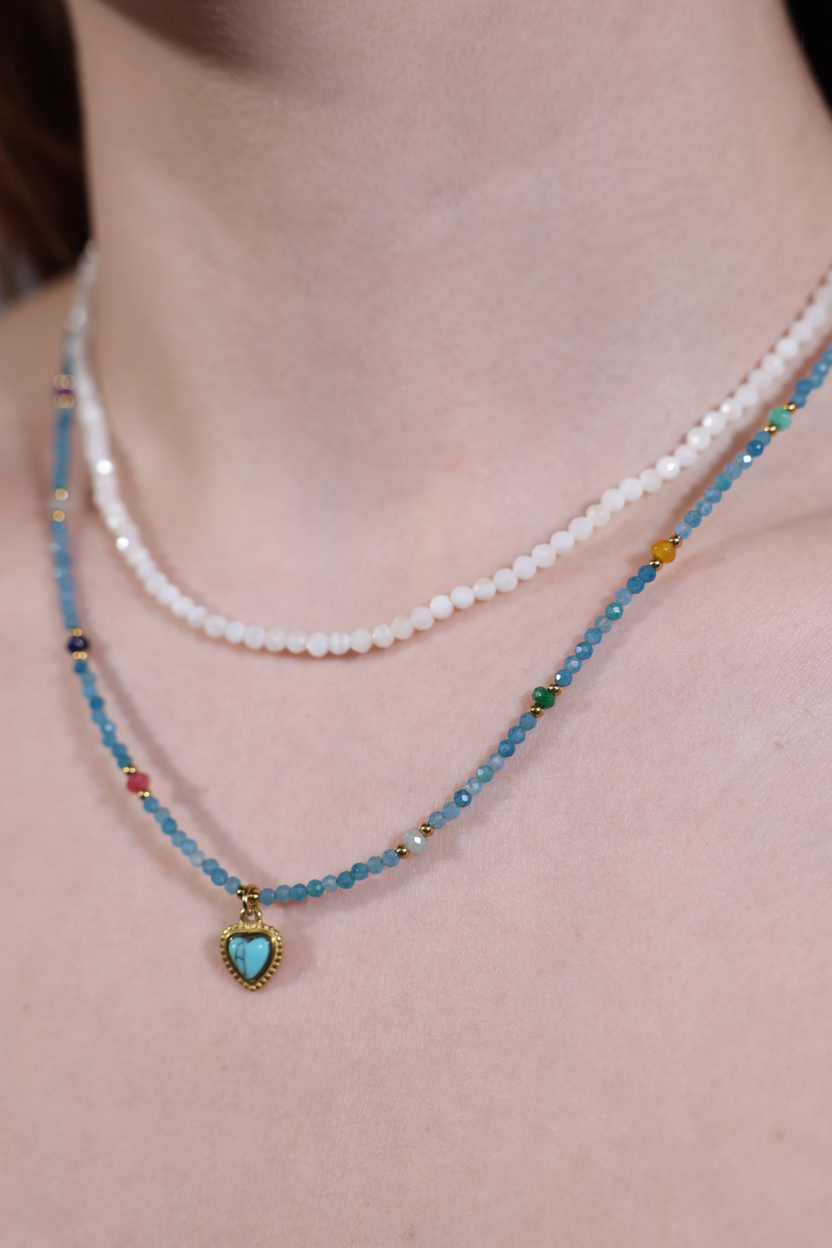 side view of turquoise heart pendant choker with aqua seed beads