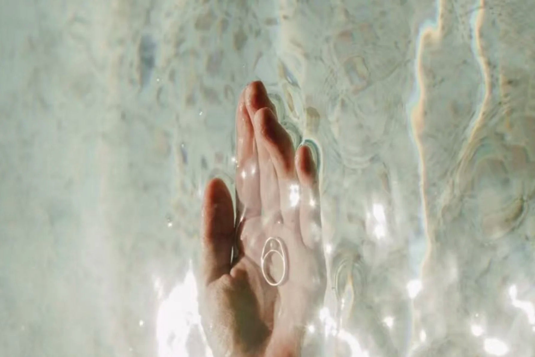 Velvet Luminance minimalist hypoallergenic ring in hand, designed for everyday confidence and effortless elegance