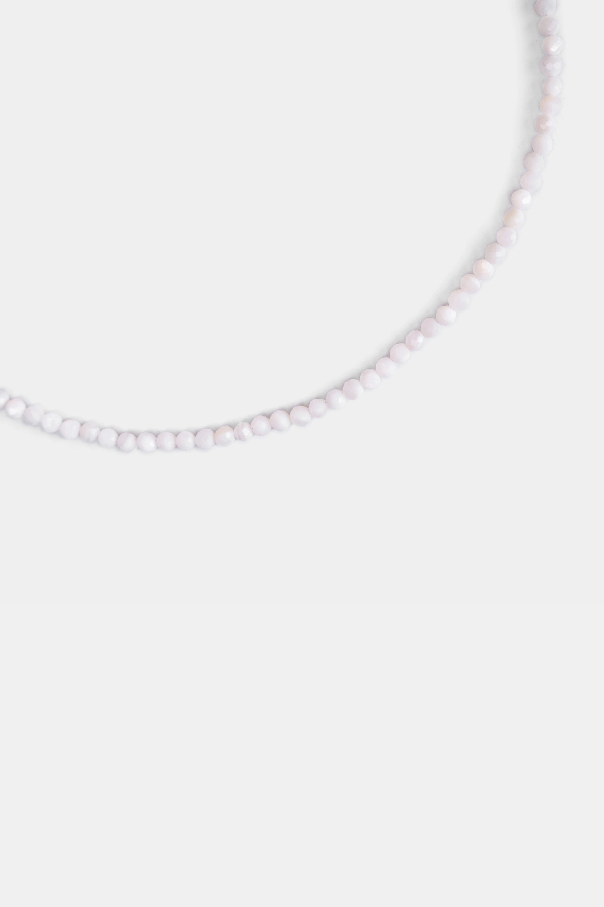 close-up of faceted white agate beads in porcelain white