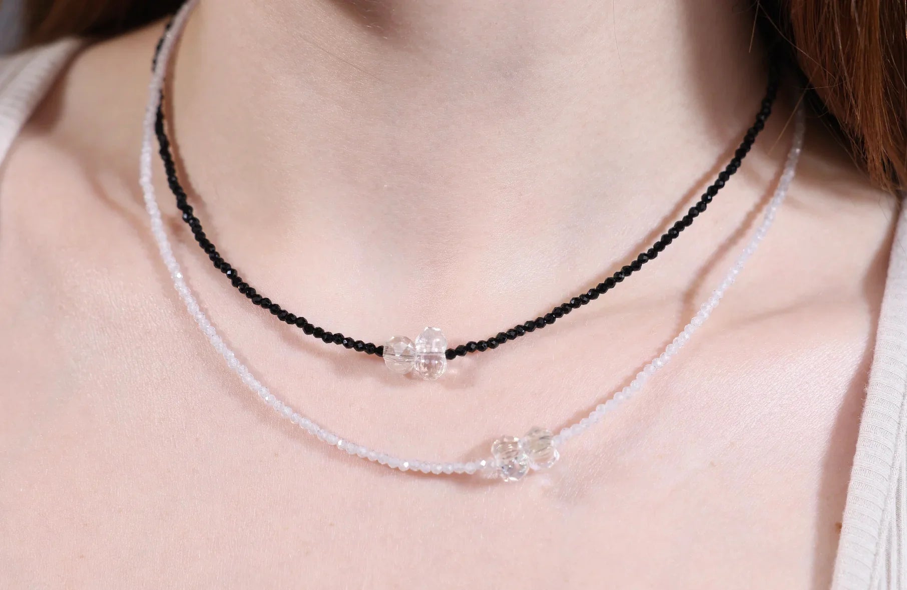 Y2K jewelry revival – black and white beaded chokers with crystal accents, trendy everyday glam styled by Velvet Luminance.