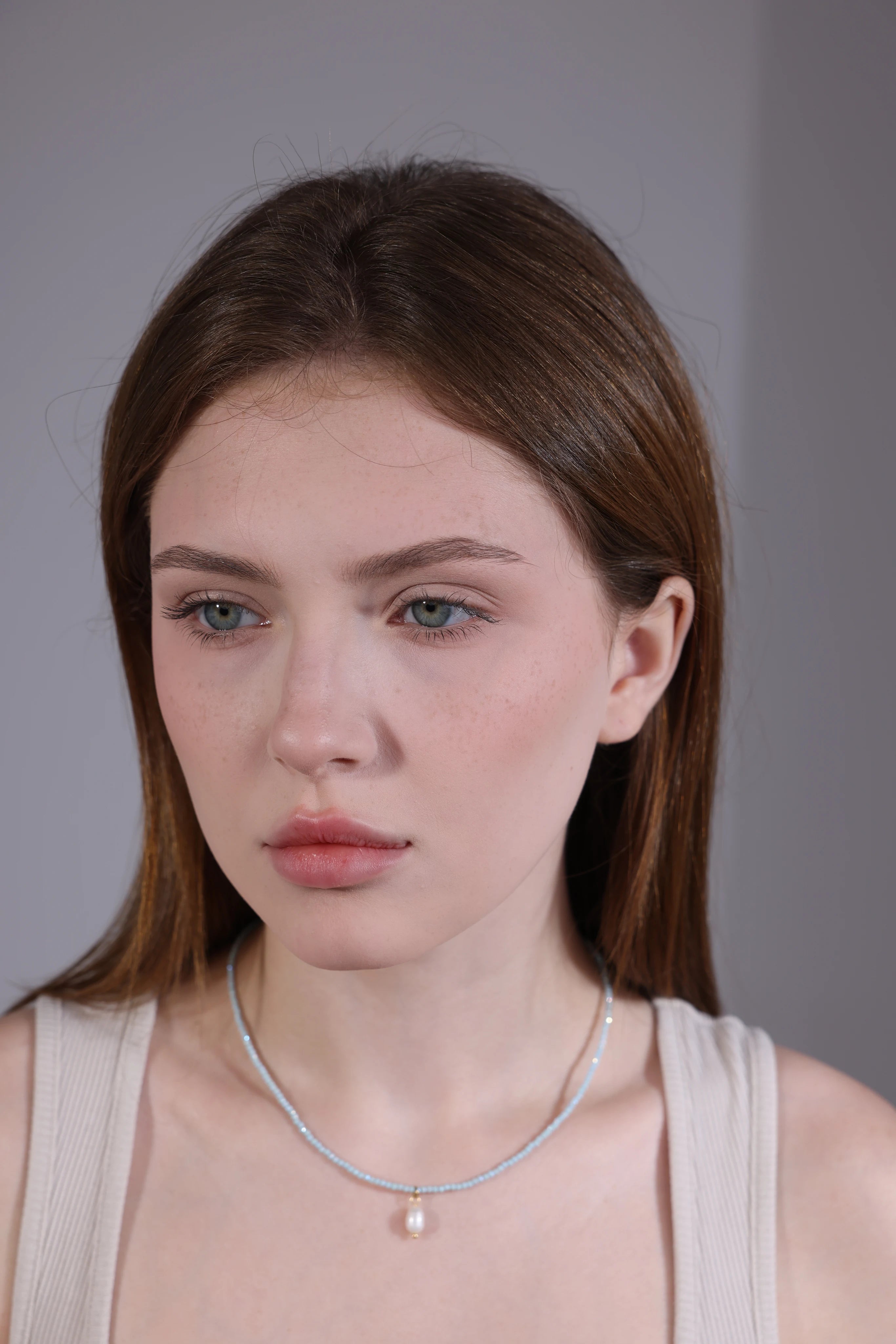 model wearing blue chalcedony pearl choker – minimalist layering