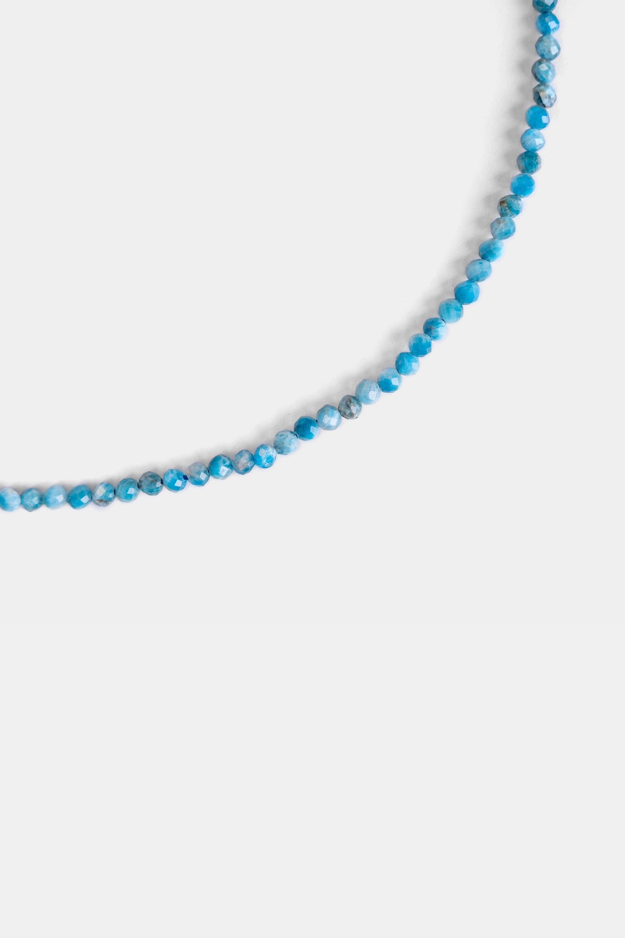 close-up of faceted larimar beads in Caribbean blue