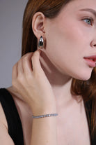 model wearing silver-tone cubic zirconia tennis bracelet – minimalist style