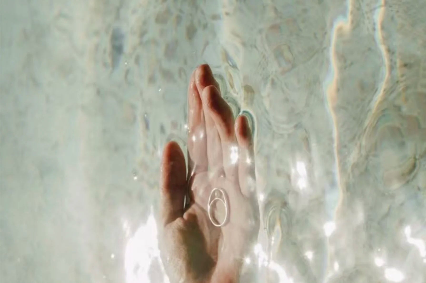 Velvet Luminance minimalist hypoallergenic ring in hand, designed for everyday confidence and effortless elegance